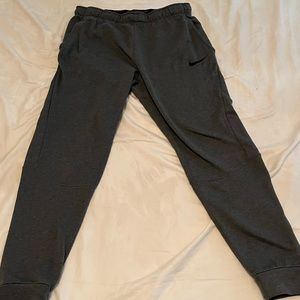 A pair of grey Nike dry fit sweatpants. Size medium. Good condition!